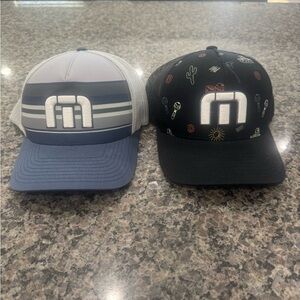 Travis Mathew Gray and Blue and a black one SnapBack and the other flex fit
